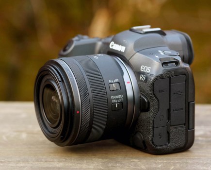 Canon RF 24mm F1.8 lens mounted on a Canon EOS R5, side view.